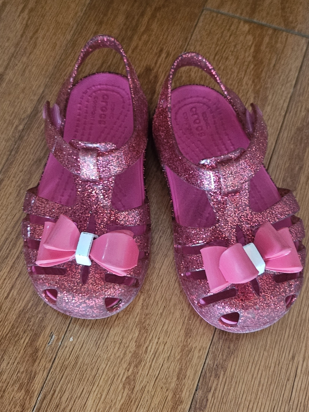 CROCS Girls Glitter Jelly Sandals with Pink Bows
